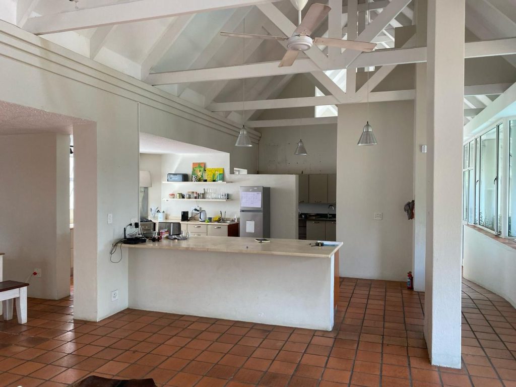 Kitchen and dining area with terracotta tiles before renovation, Benmore Gardens