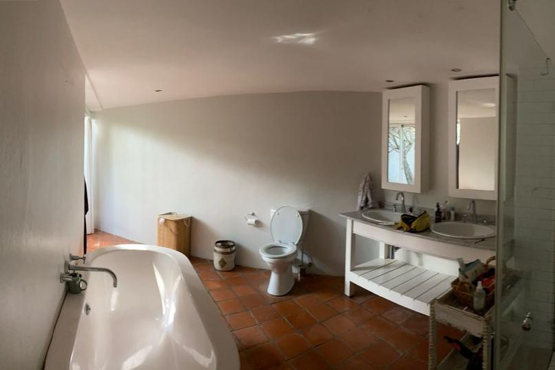 Bathroom with terracotta tiled floor before renovation, Benmore Gardens