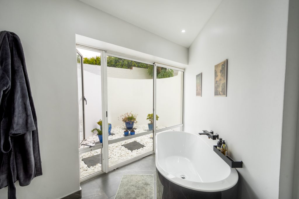 Angus7 Main bathroom with freestanding tub and private courtyard, Benmore Gardens